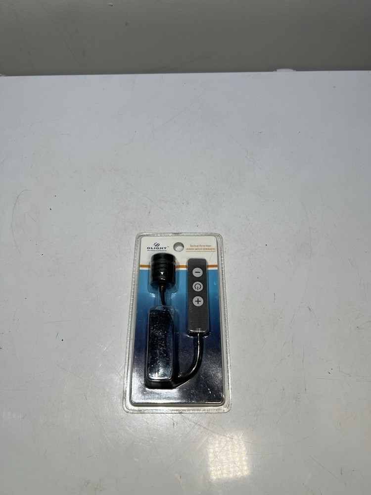 Olight tactical remote switch with keys.