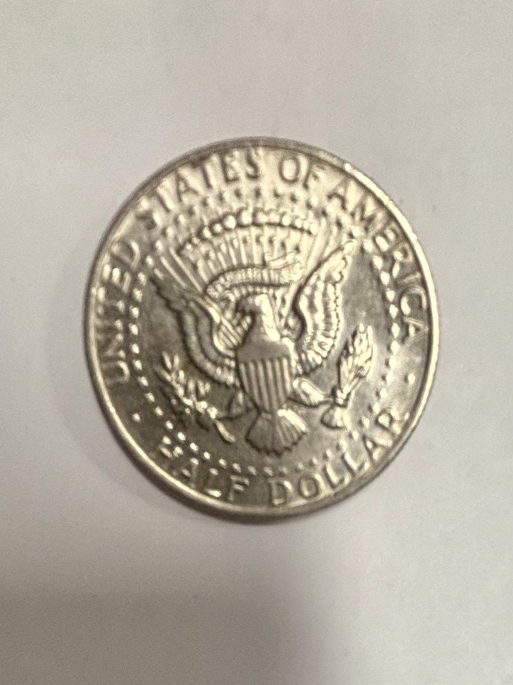 1973 Kennedy Half Dollar With No Mint Mark, Error On E