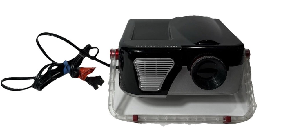 The Sharper Image Entertainment Projector Model 1614974  Turns On- Works -