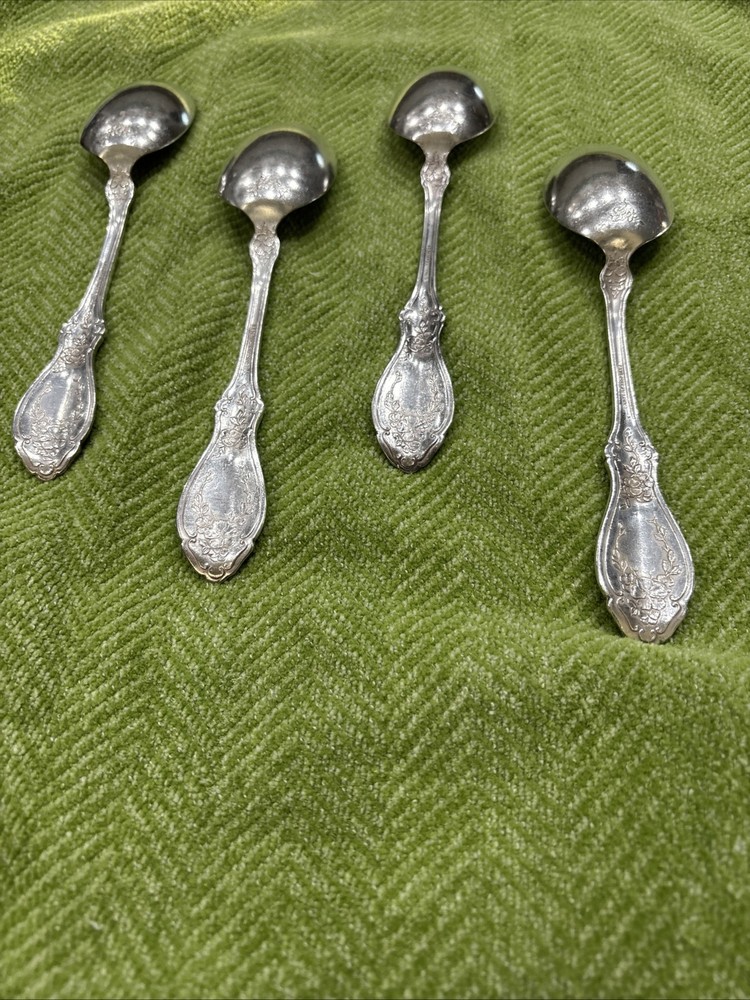 4 silver plate Rogers serving spoons