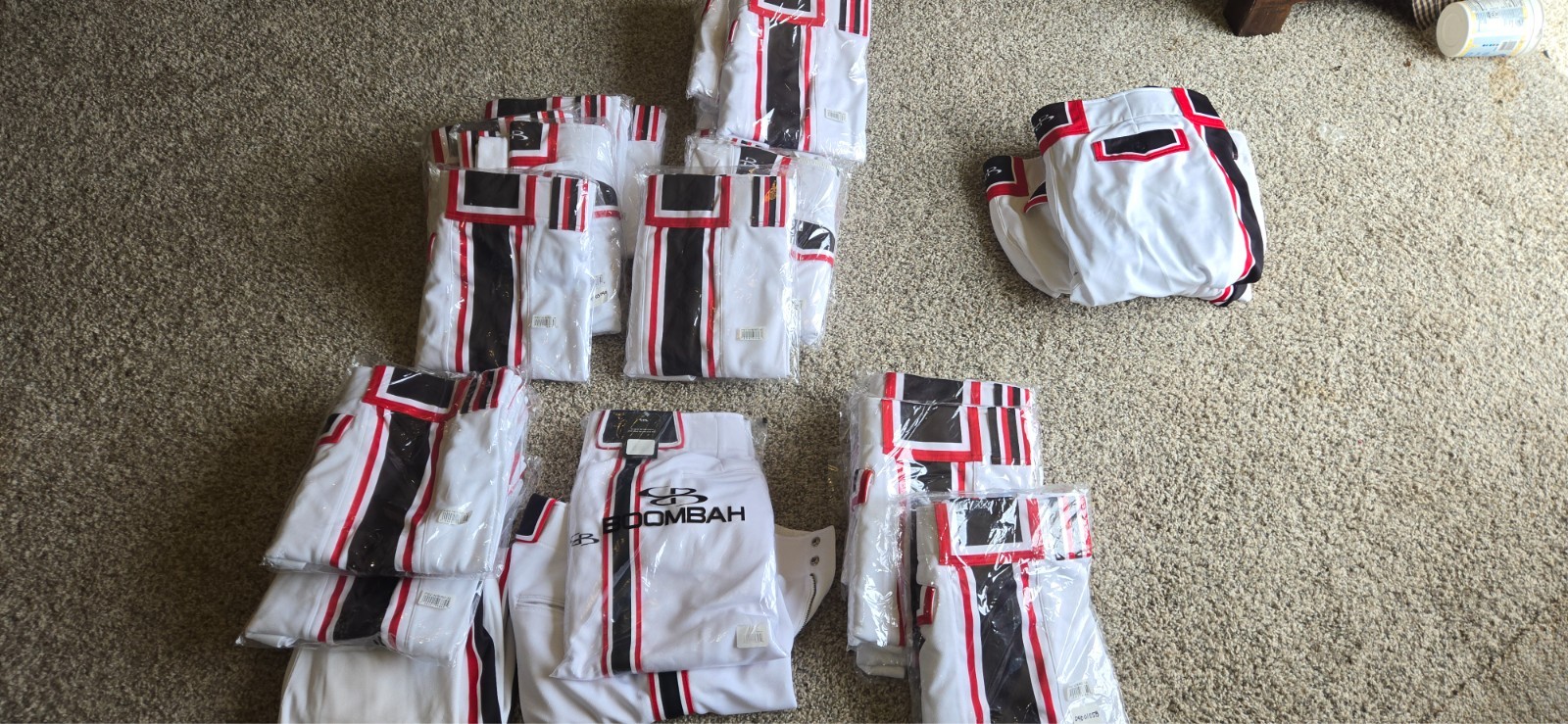 70 pairs Men's softball pants, White, Red, Black. Most new.