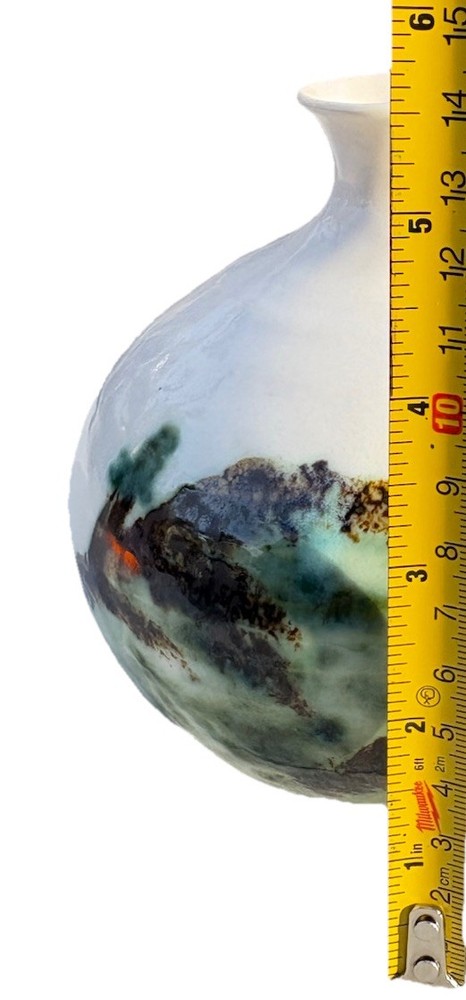 ceramic vase with an "Evergreen" design, featuring a water etching