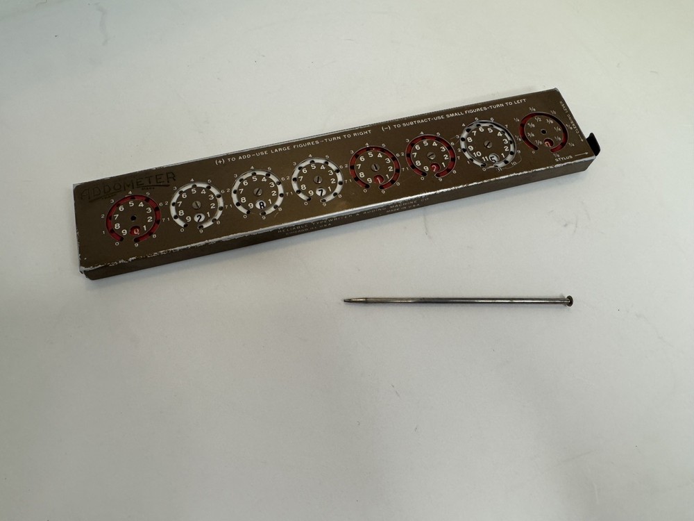 Addometer stylus-operated adding machine. Vintage mechanical calculator.