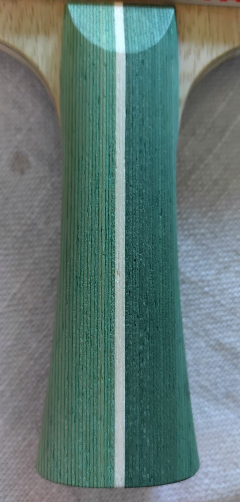 Stiga Aura Hybrid Carbon paddle-flared handle with rubber sheets