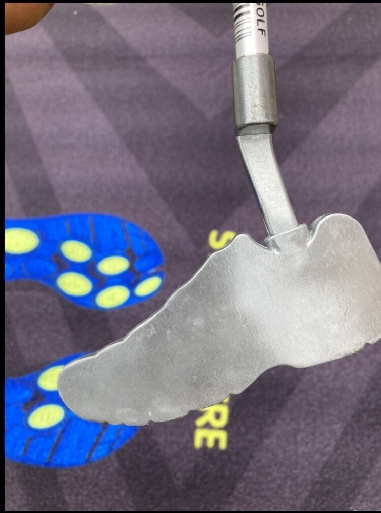 Brooks golf putter with putting mat
