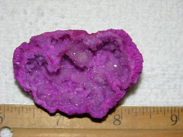 Geode cut & polished half with colored crystal center 2 inch E3