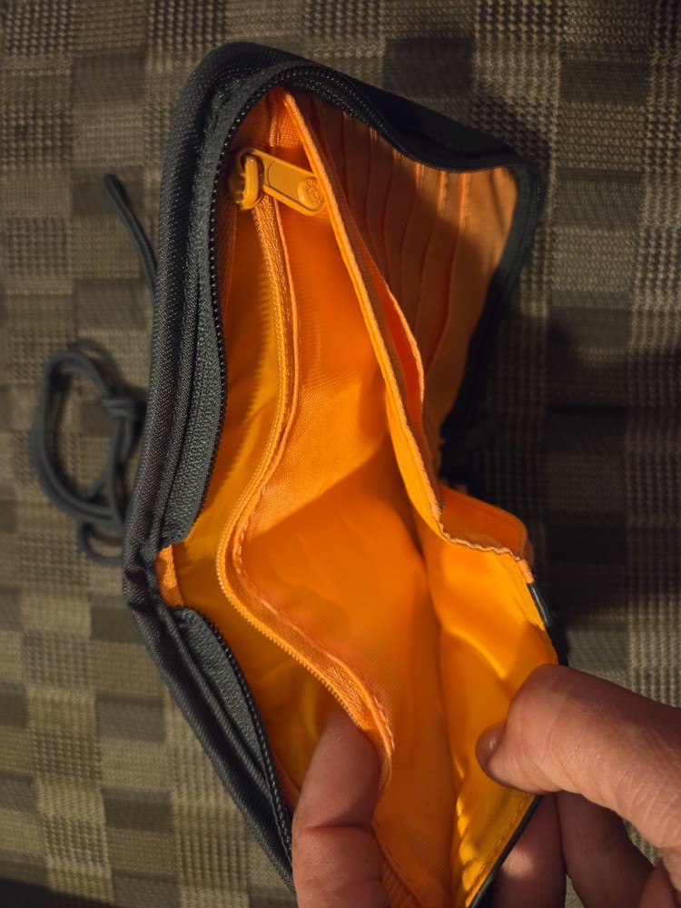 Pacsafe® RFIDsafe™ RFID blocking compact travel organizer, gray (orange inside)