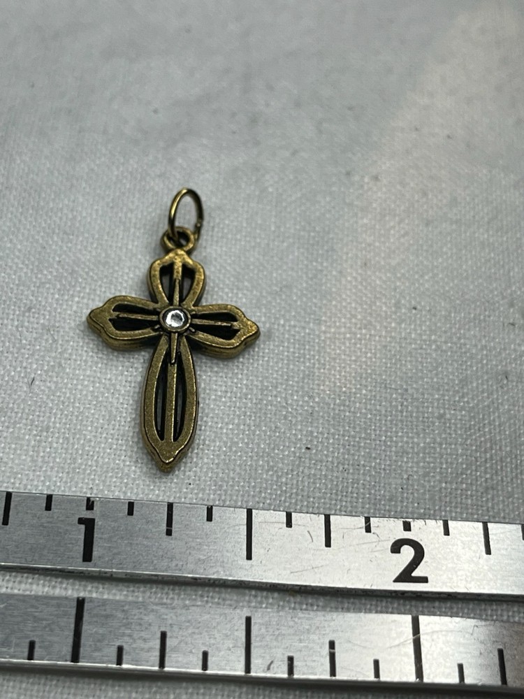 Gold/ Brass Tone Cross With Clear Stone