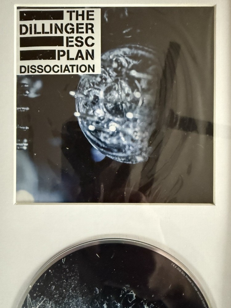 THE DILLINGER ESCAPE PLAN - Framed ‘DISSOCIATION’ Booklet + CD (Unsigned)