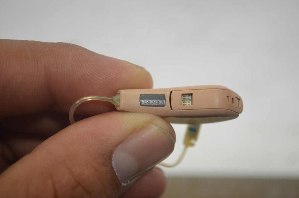 Resound Hearing Aids as is not tested missing button , might affect function