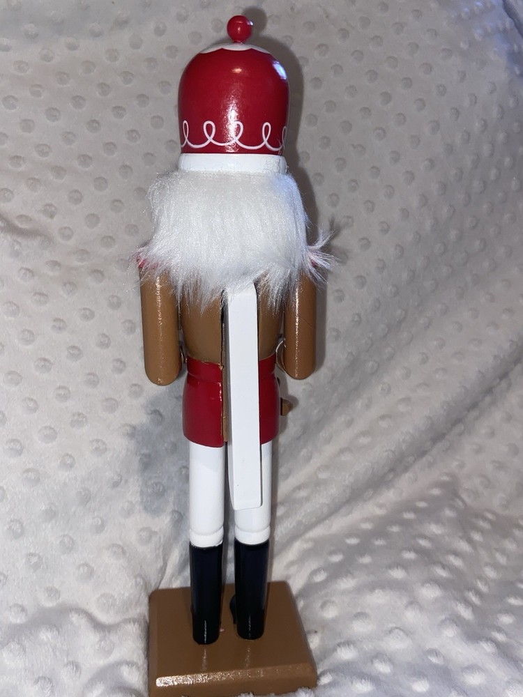 Wood Nutcracker With A String Of Gingerbread Men.