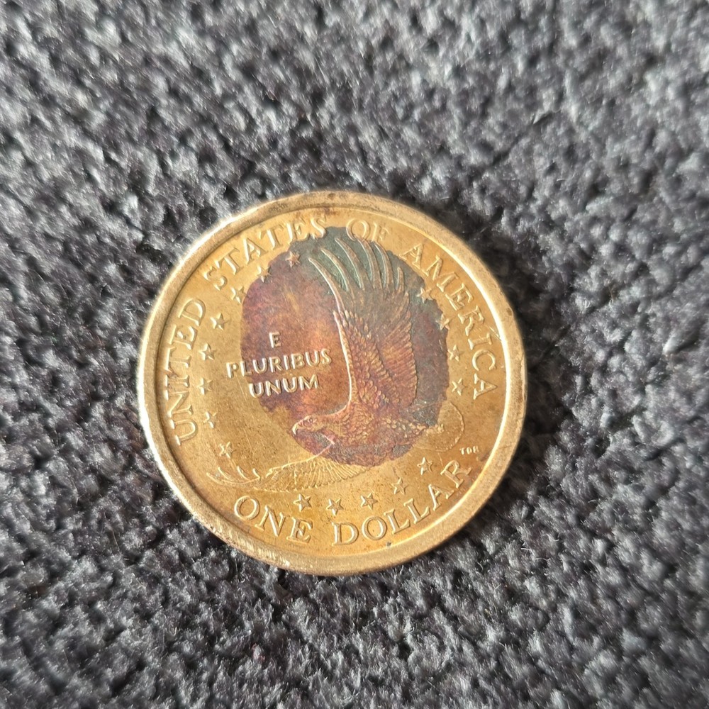 2000 sacagawea coin partially missing clad layer.