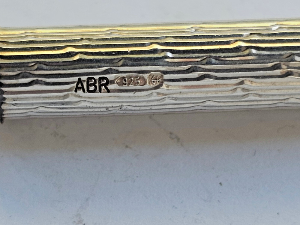 Engine turned silver tooth pick with plastic tool
