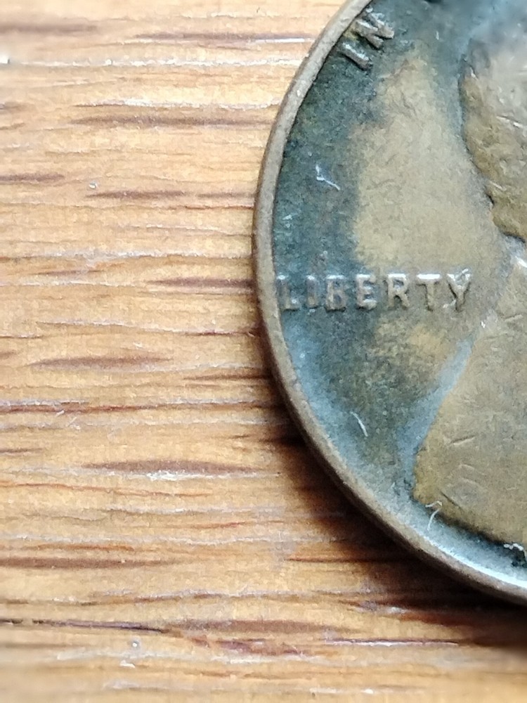 1944 wheat penny no mint mark error, "L" On Rim