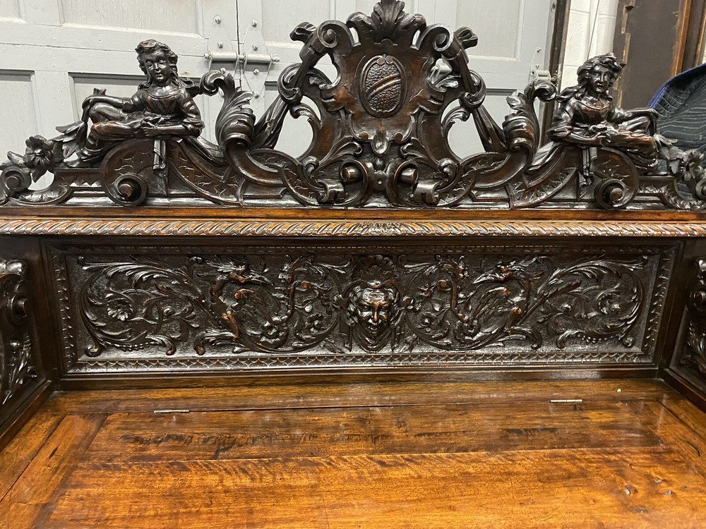 CARVED FIGURAL WALNUT BENCH