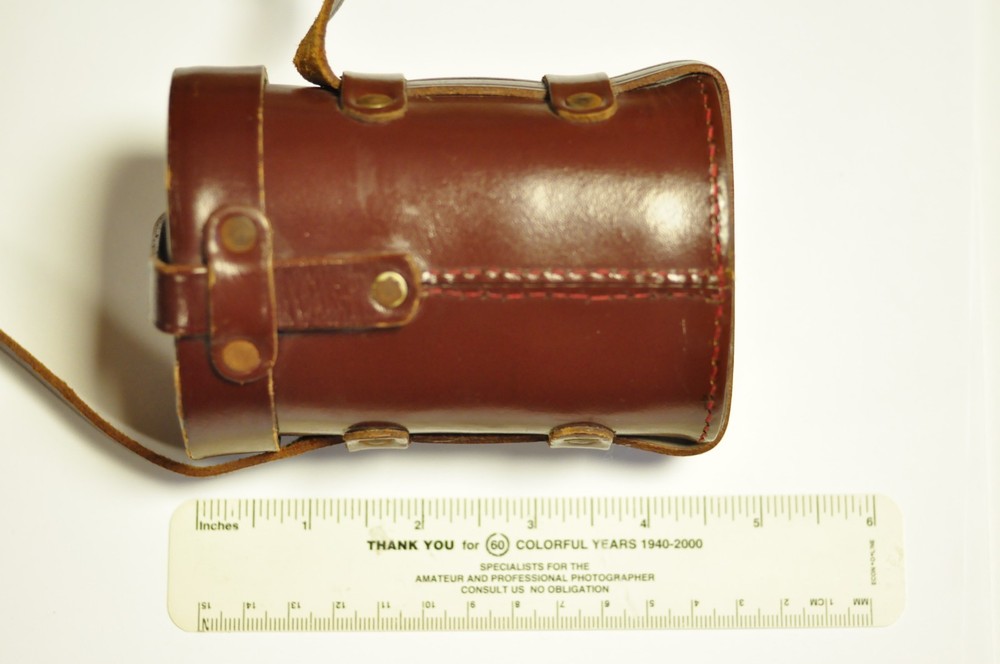 Brown leather oval lens case as shown. READ.