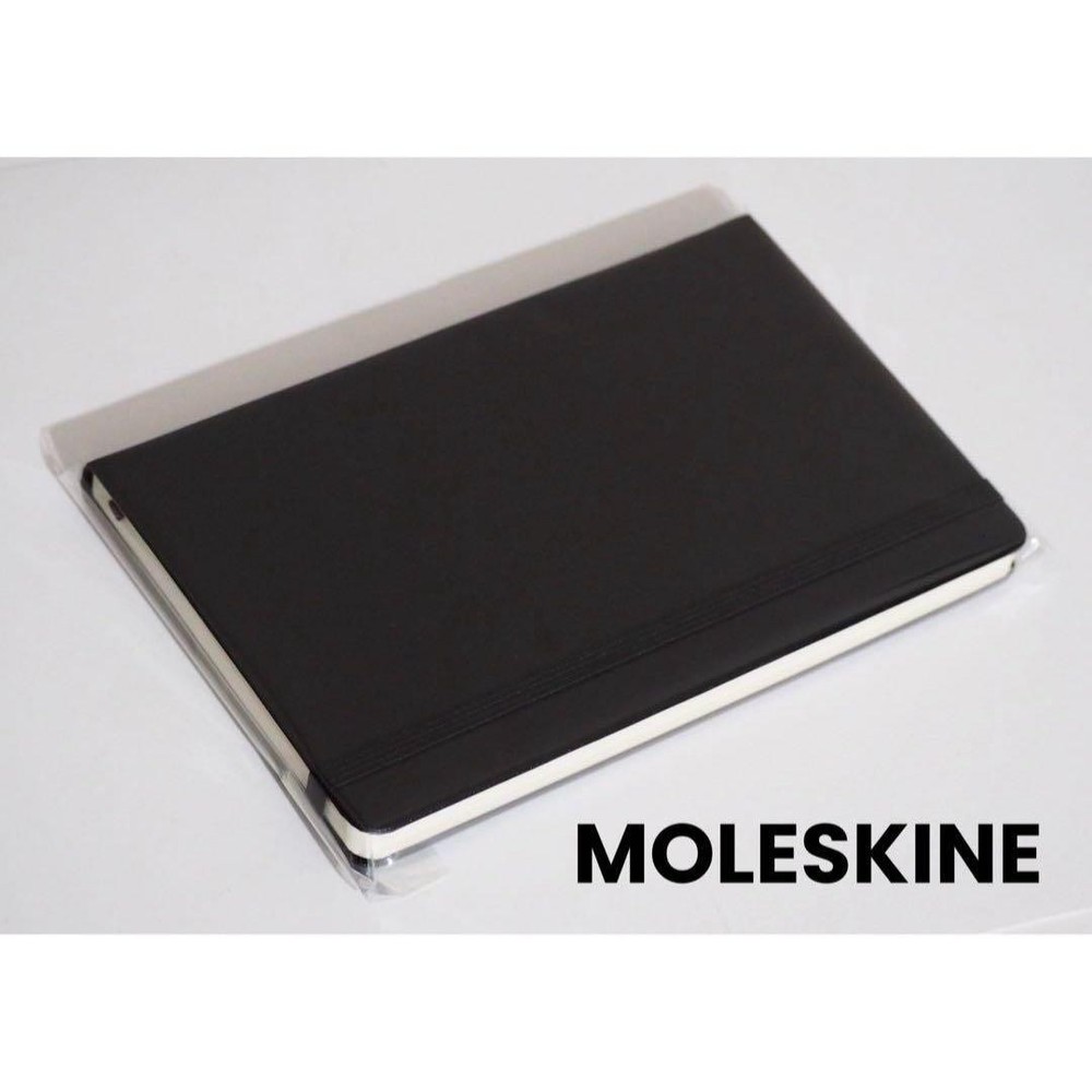 Opened and  MOLESKINE plain notebook 1 book