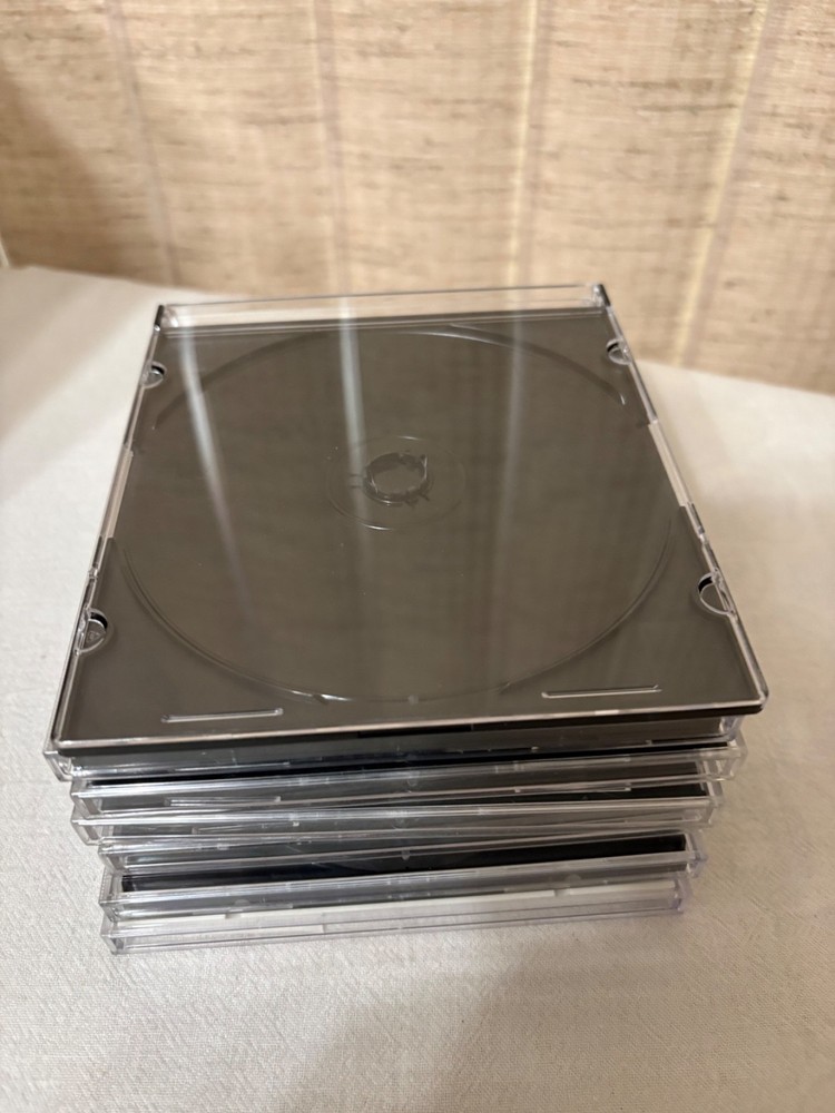 Plastic Disk Storage Shelf With 7 Pre-Owned Plastic Disk Cases