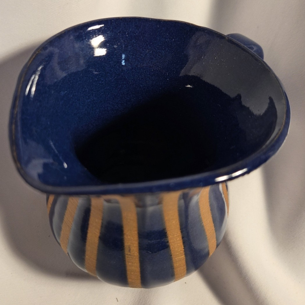 Pottery pitcher 2 toned with handle.