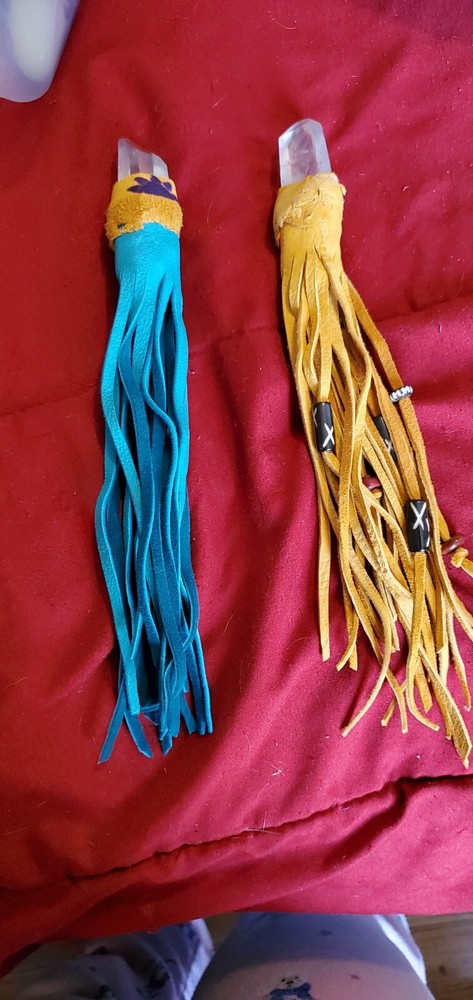 custom made wand tip,  quartz with leather strands.