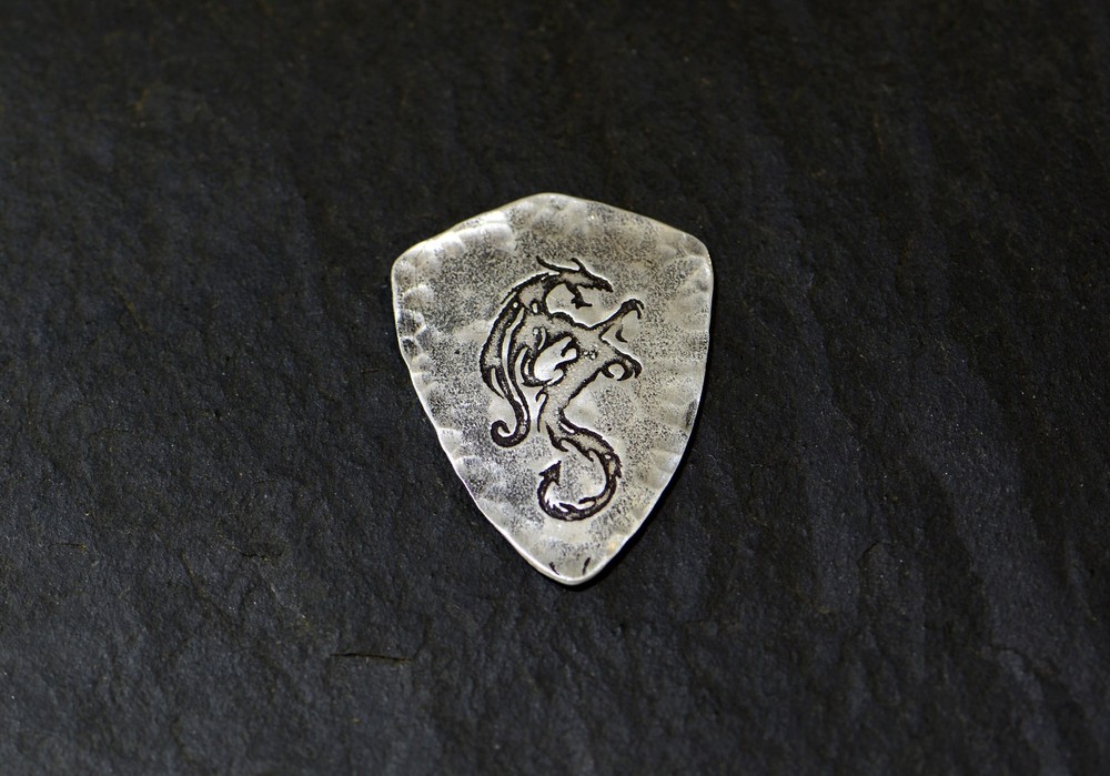Sterling silver dragon guitar pick in shield shape
