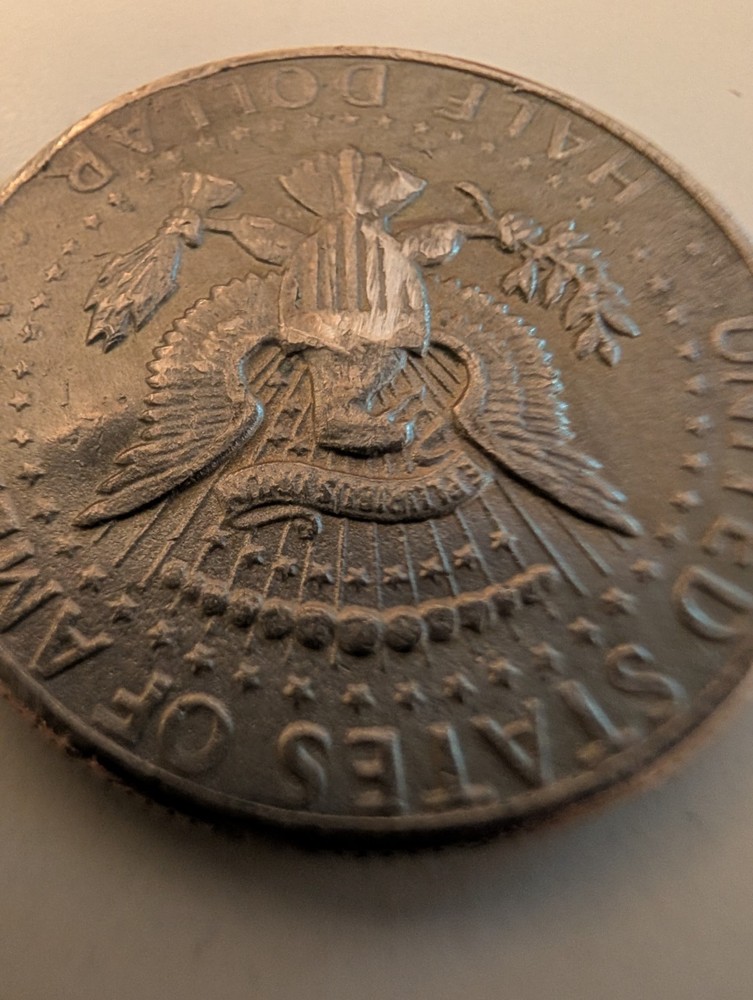 1971 Half Dollar Struck Through Wire And Error On His Cheek