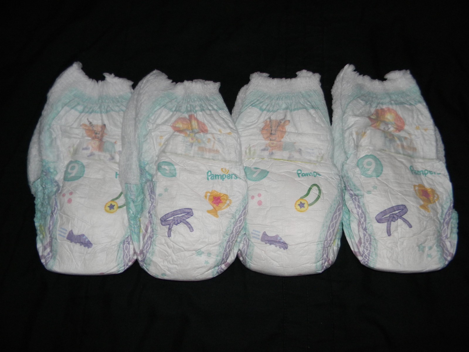 4 Pampers size 9 pants 41+Lbs. made to fit 32 in waist easy.