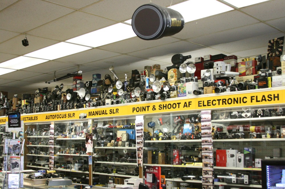 Suntar medium format flash / accessory / grip bracket with a cable release.