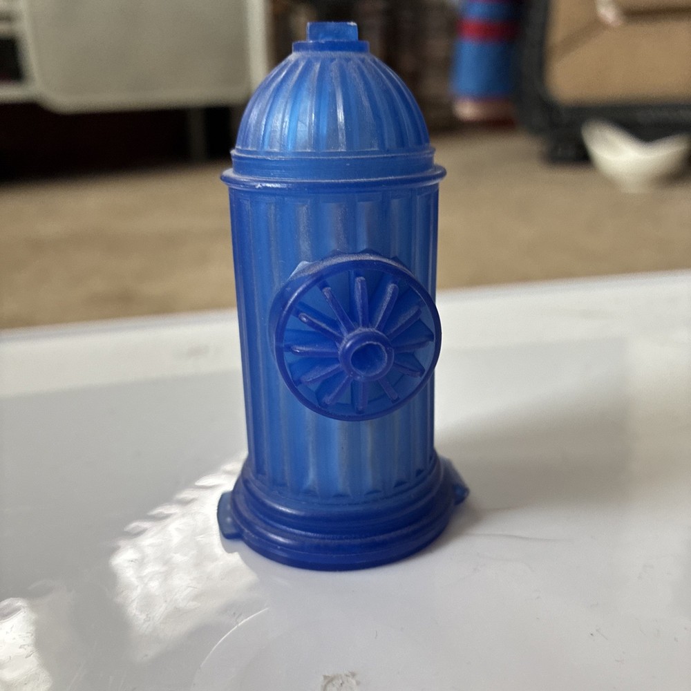 Vintage 70's Fleer Blue fire hydrant candy holder. 2.5 inches. Container empty.