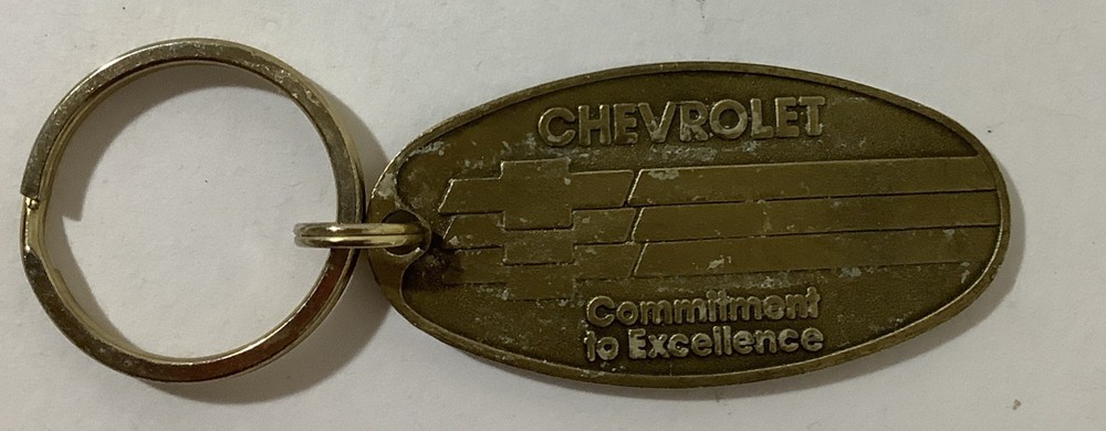 Chevrolet Commitment To Excellence Brass Return Postage Key Chain Ring Tag