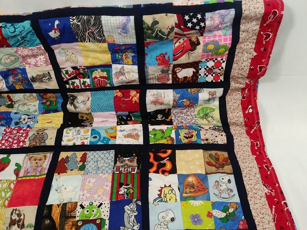 HANDMADE QUILT CHILDRENS 35”x52” multi character