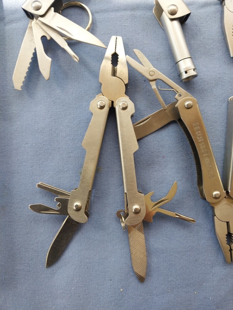 4 small multitudes with pliers knife scissors screwdriver's