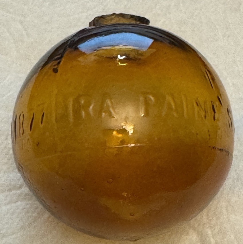 SUPER RARE ANTIQUE IRA PAINE’S FILLED AMBER GLASS TARGET/SHOOTING BALL, 2.5”
