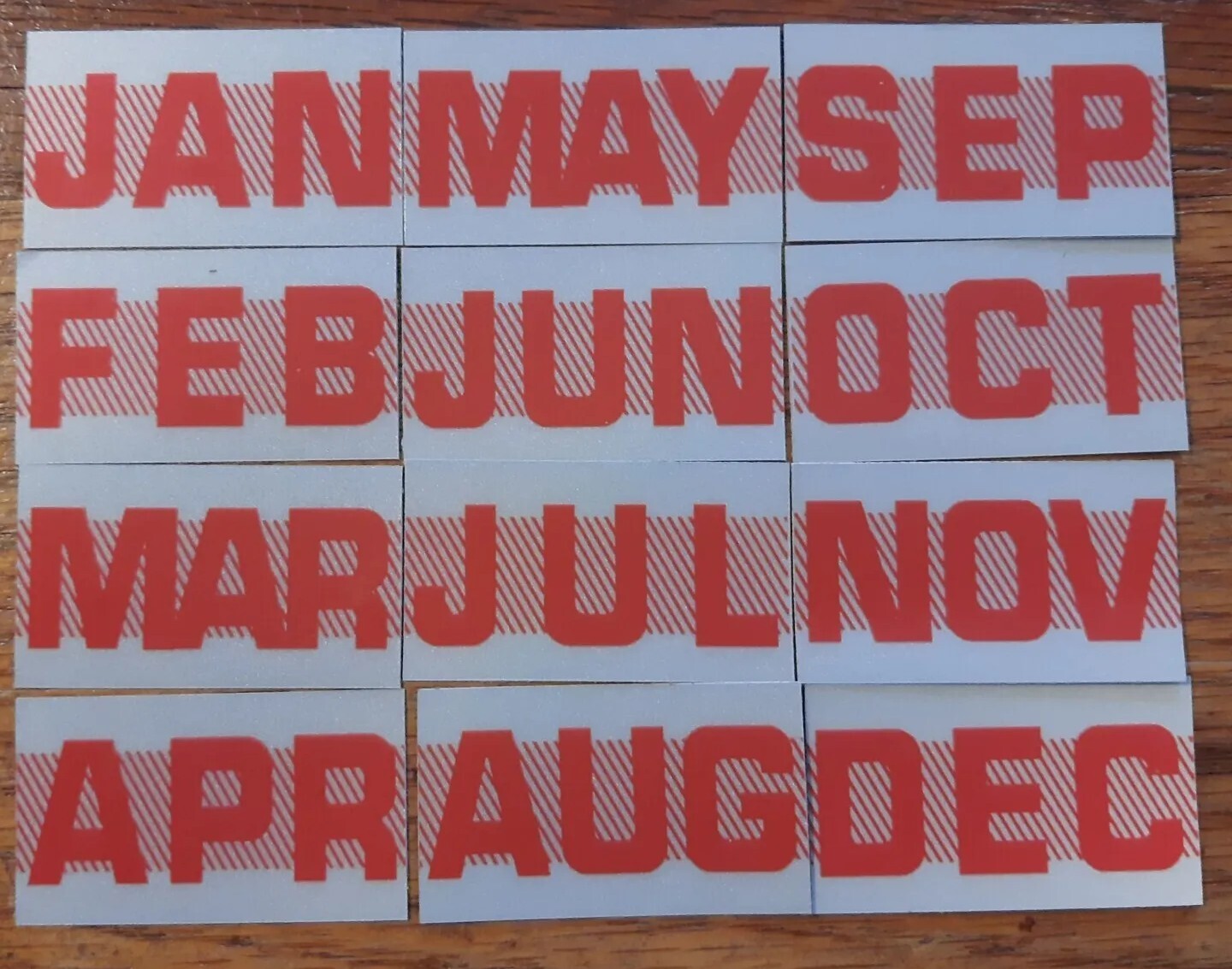 California license plate month sticker tags. (2) RED. YOM Two.