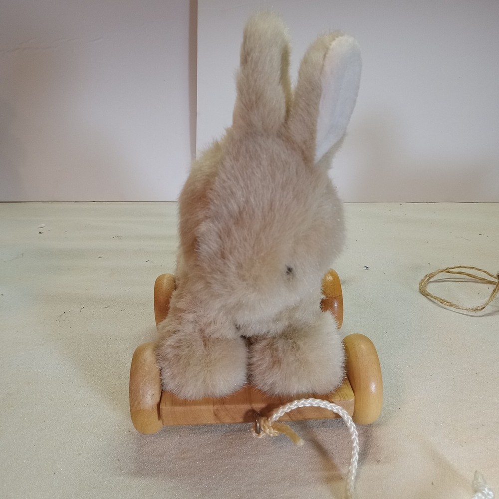 A bunny & duck on wheels pull toy