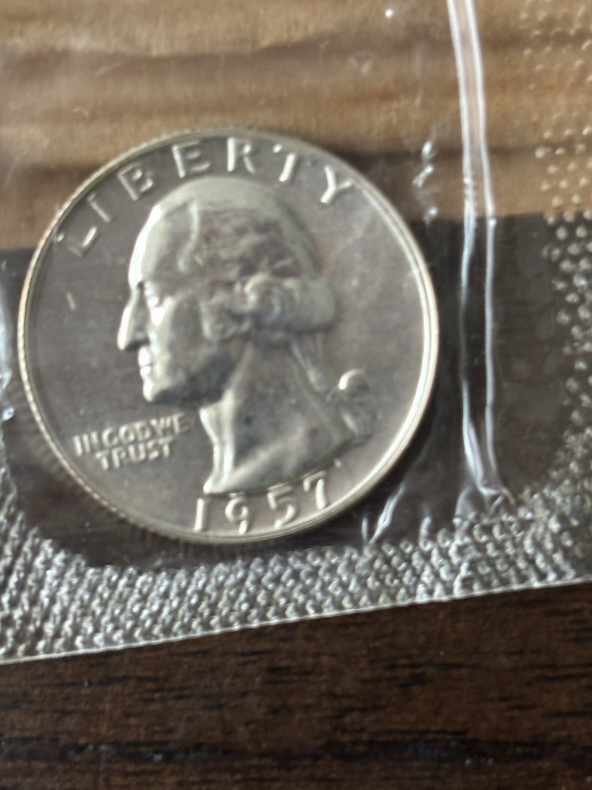 1957 U.S. PROOF SET. Coins U.S. Mint Sealed in a flat cello. (Tear in envelope)