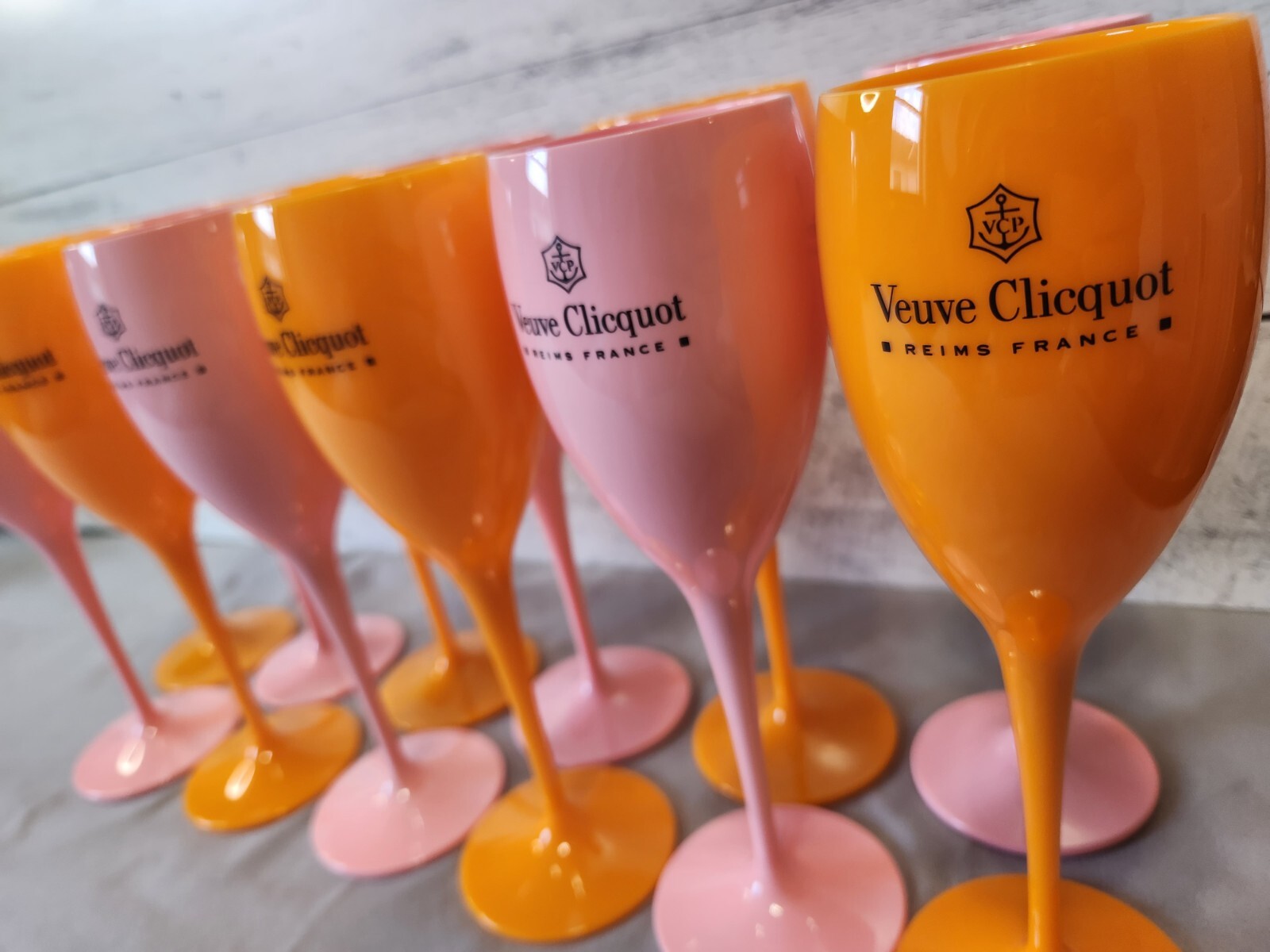VEUVE CLICQUOT ORANGE AND PINK ACRYLIC CHAMPAGNE FLUTES 12 TOTAL NEW