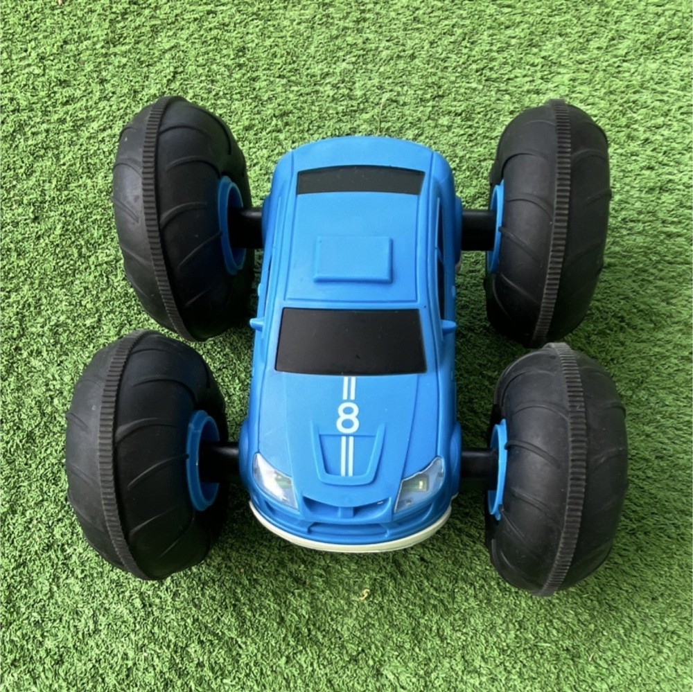 Remote-Controlled Stunt Car Blue White Black Oversized Wheels LED Lights