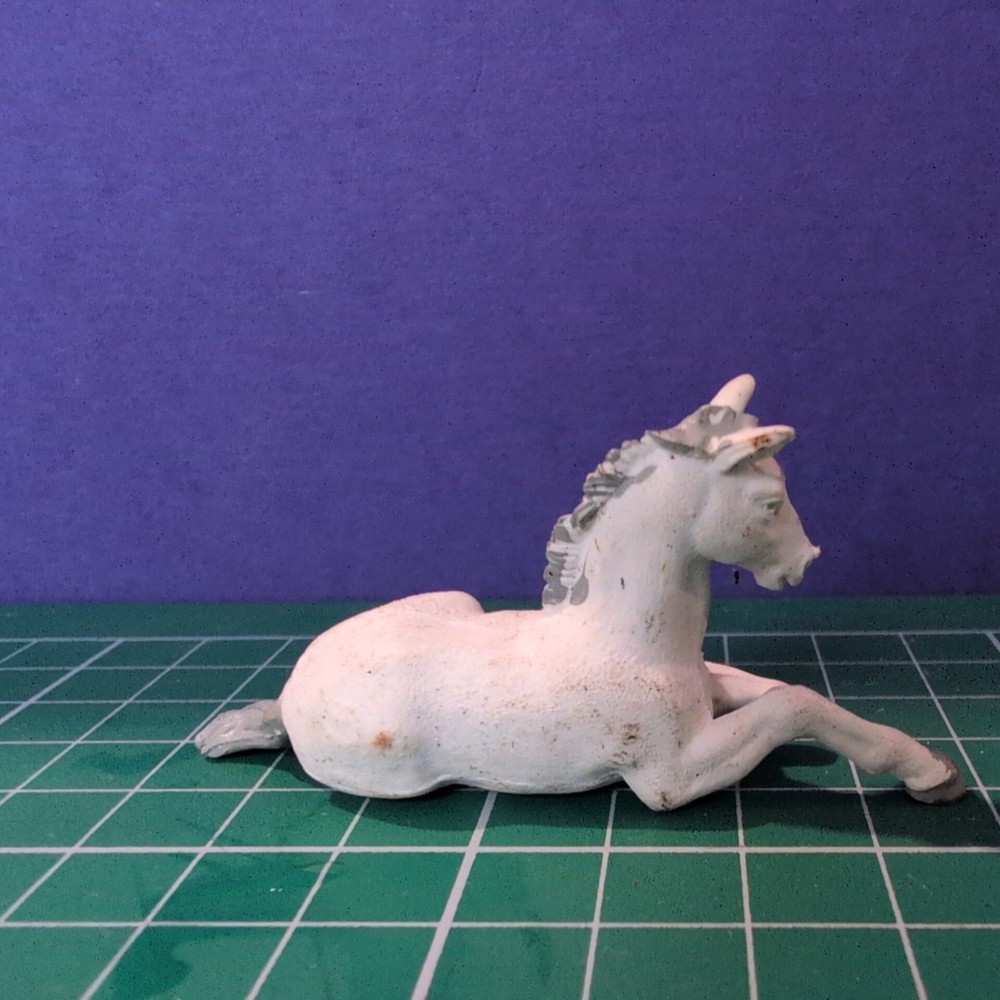 Britain's Farm - White Colt Lying Down