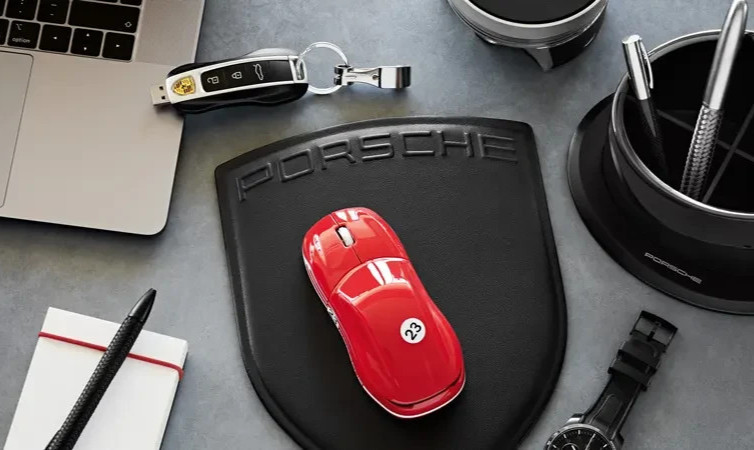 PORSCHE DESIGN EMBOSSED LEATHER COMPUTER MOUSE PAD IN THE SHAPE OF PORSCHE CREST