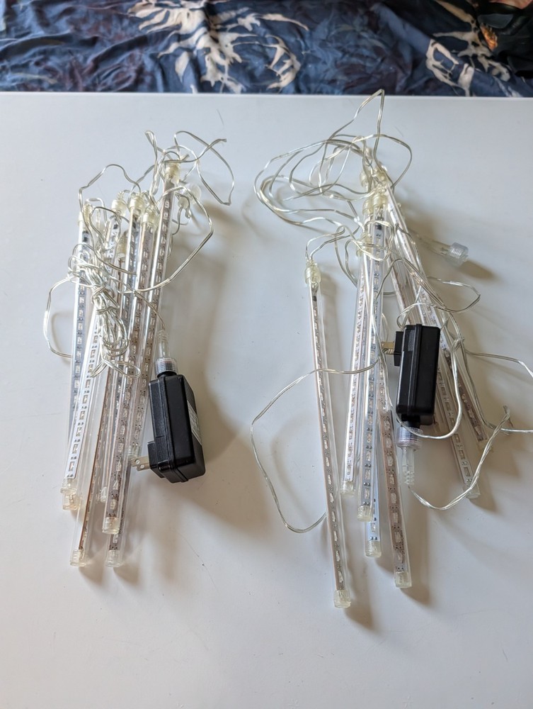 PREOWNED OMGAI LED METEOR LIGHTS SET 8 TUBES MULTI COLORED 2 SETS LINKABLE