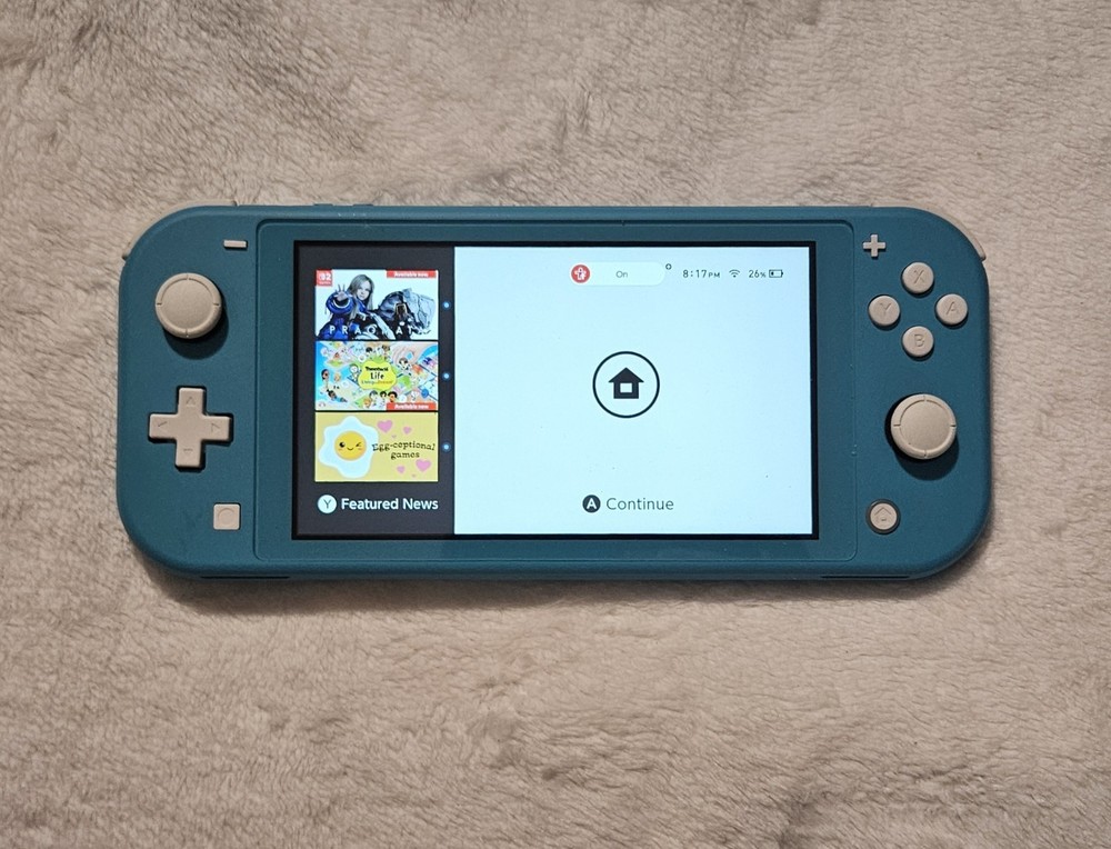 Nintendo Switch Lite Turquoise Bundle (Includes 5 Games)