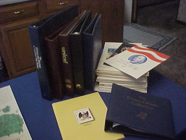 Six Stamps Album binders, 1 Cover Album, and 37 USPS Stamp Folders