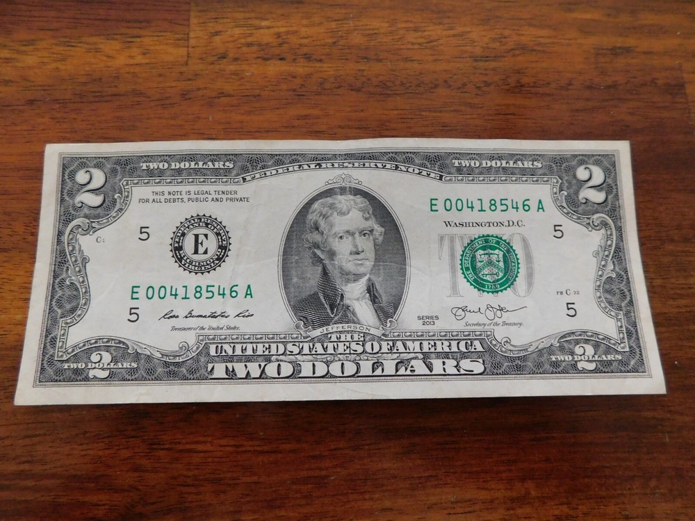 U.S. $2 Two dollar bill with low serial number E06Ak.