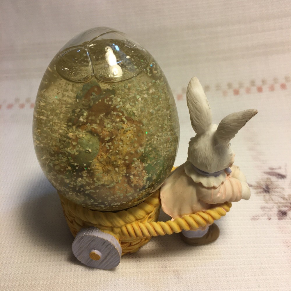 Rabbit Pulling Cart Snow globe Filled With Easter Eggs. Super Cute