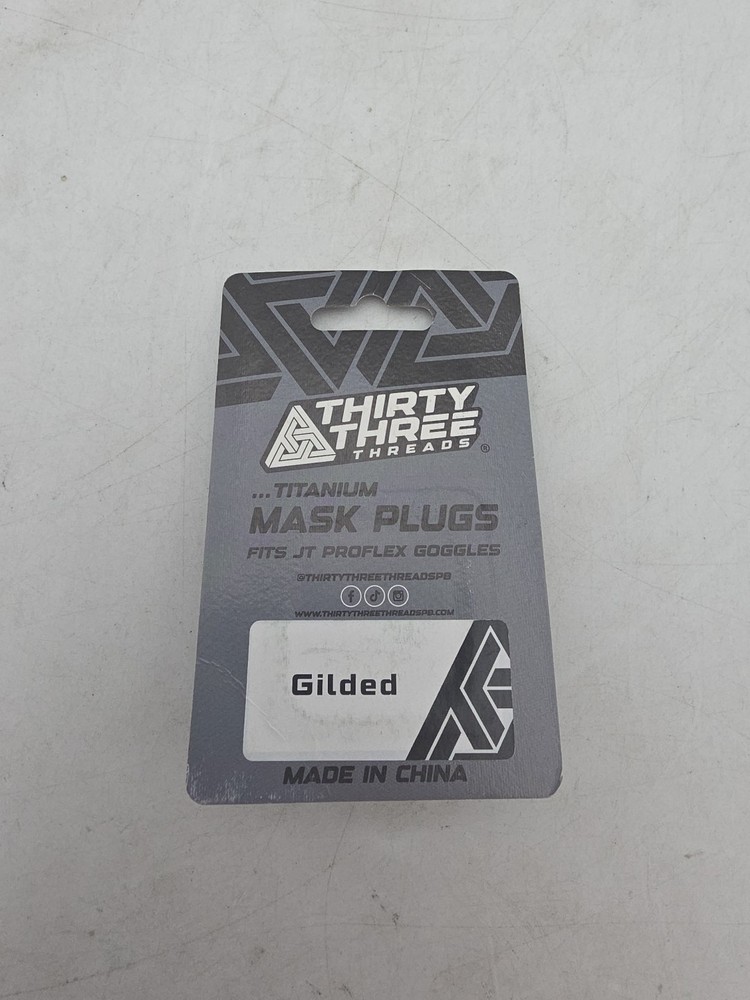 Thirty Three Threads Titanium Mask Plugs. Gilded