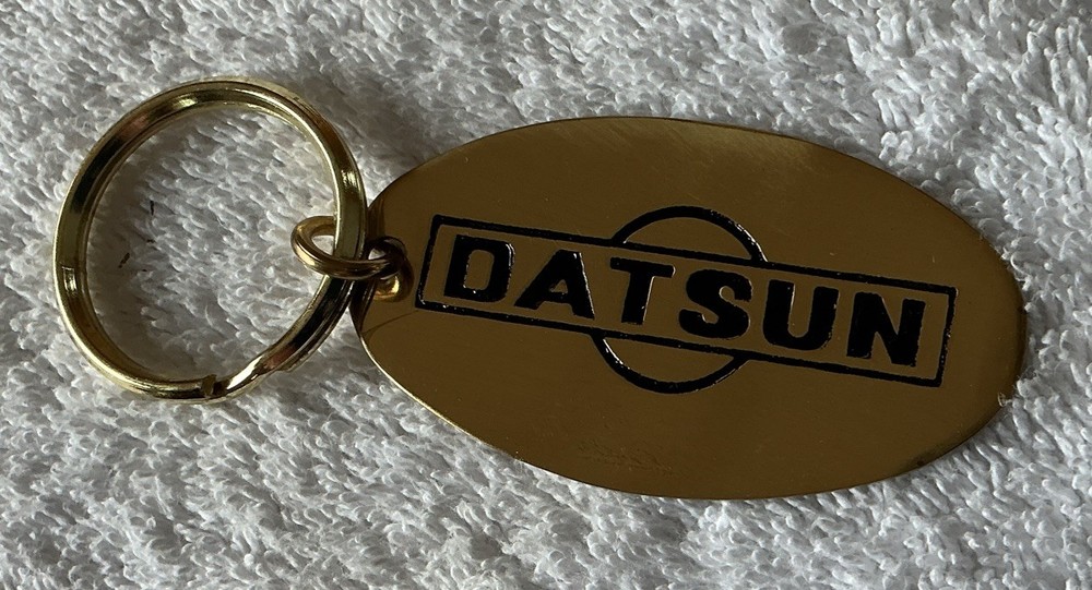 Brass Datsun Keychain, 2.5”x1.5” , Nice Shape