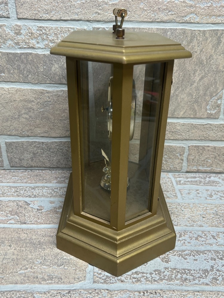 Quartz Clock Rotating Pendulum