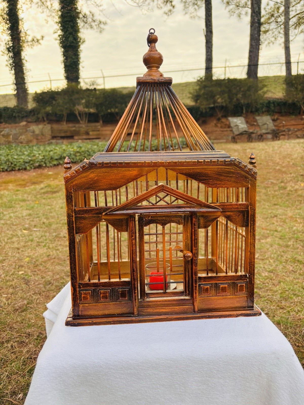 Wood Birdhouse with a pagoda-style top and intricate architectural details
