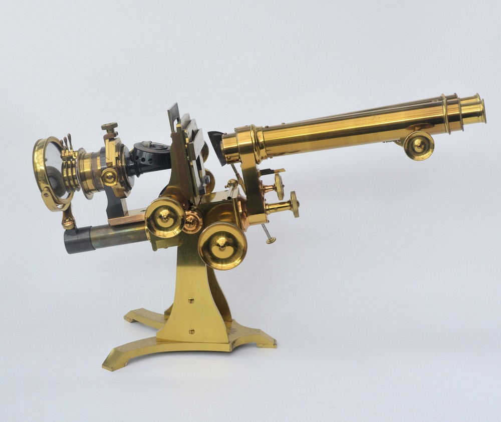 Very large binocular microscope in case with accessories.